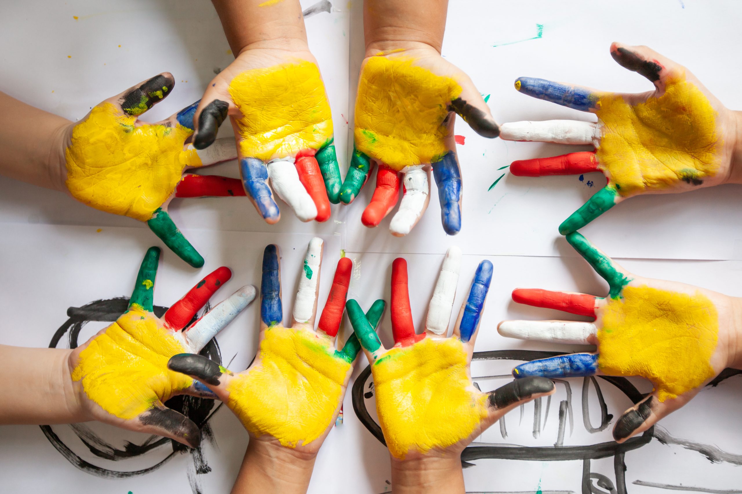 children's hands in colorful painted